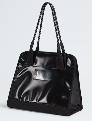Burly Tote Bag Designed with Rope Inspired Handles and Front Adjustable Straps Offering Large Secure Zip Pocket Key Hook and Topographic Lining